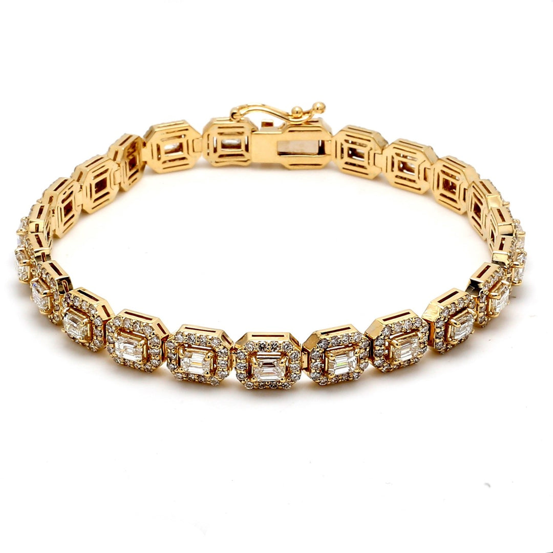 7"" Halo bracelet in 14K YG with prong set (23) emerald cuts and pre-set round diamonds.  D7.10ct.t.w.