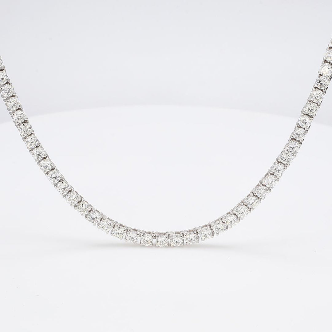 24"" Tennis necklace in 18K WG with 4-prong set (123) round diamonds.  D49.09ct.t.w.
