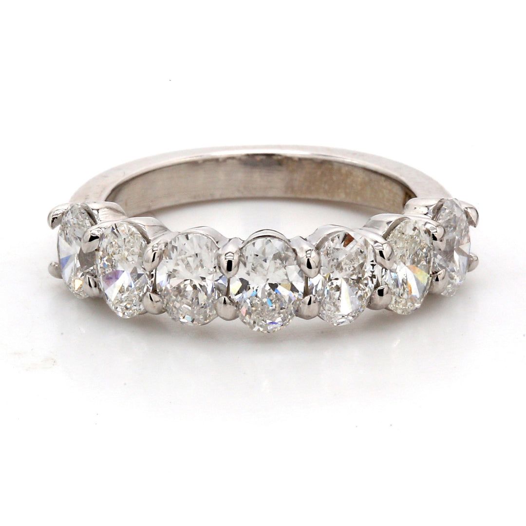 7-stone band in platinum with basket prong set oval cut diamonds.  D2.10ct.t.w.  Size  5.5