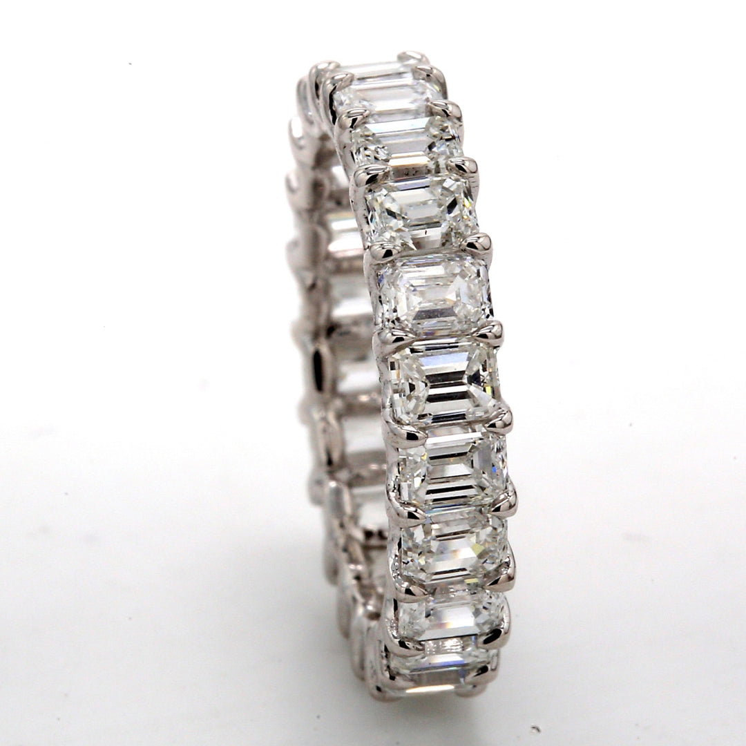 Eternity band in platinum with U-prong set (22) emerald cut diamonds.  D3.63ct.t.w.  Size 4.5