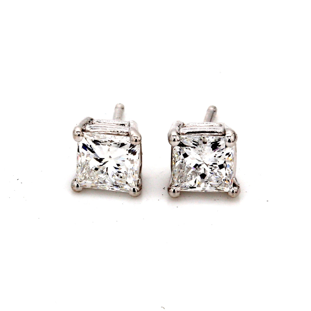 Push back stud earrings with basket prong set princess cut diamonds.  D0.99ct.t.w.
