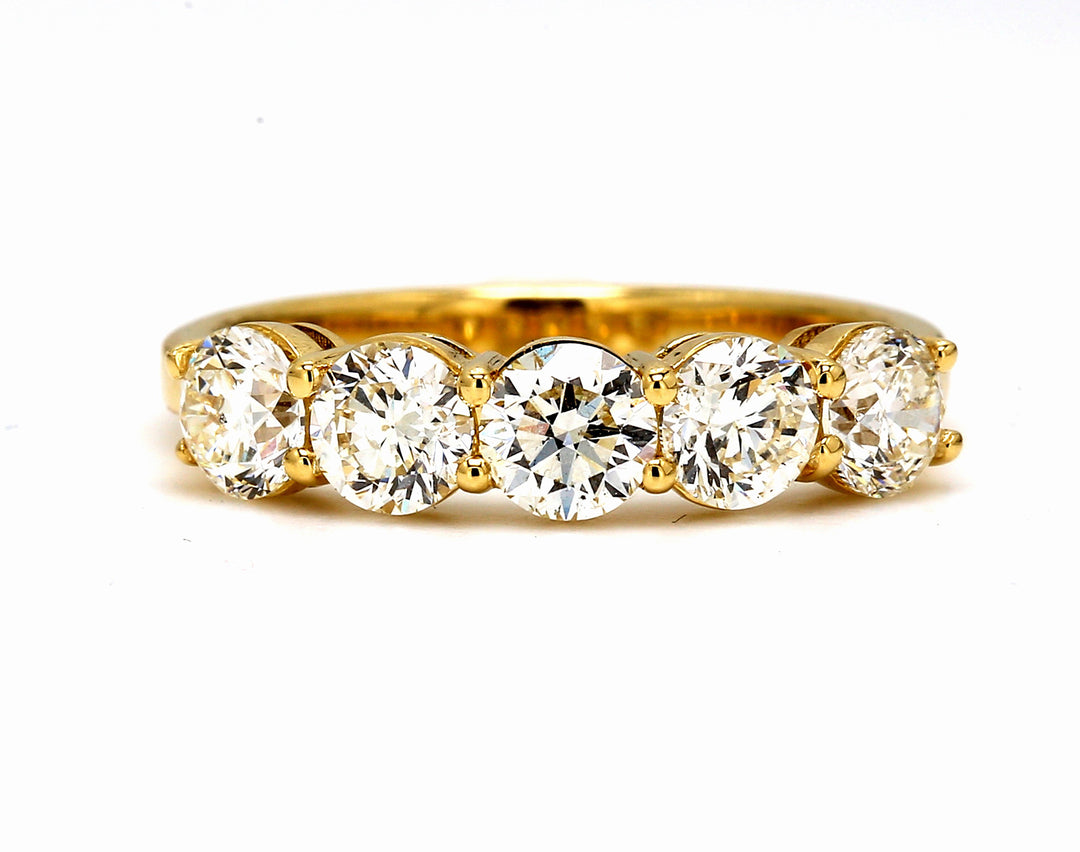 5-stone band in 18K YG with basket prong set round diamonds.  D1.50ct.t.w.  Size 6.75