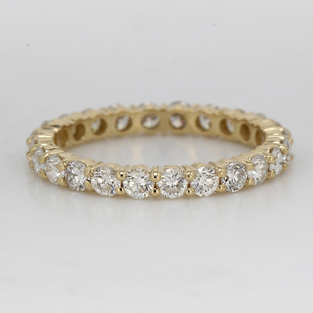 Eternity band in 14K YG with shared prong set round diamonds.  D1.09ct.t.w.  Size 4.75
