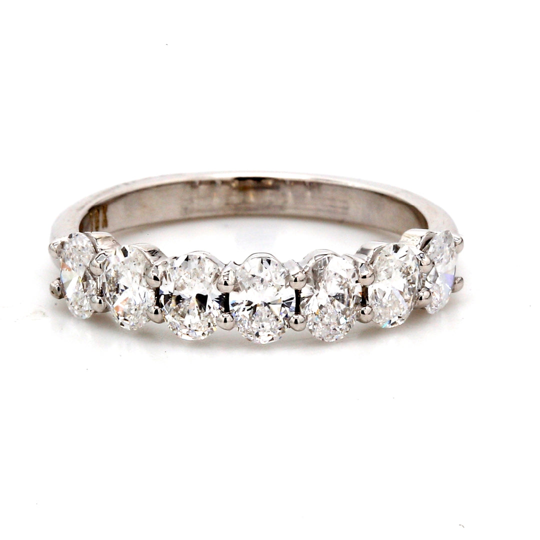 7-stone band in 18K WG with basket prong set oval cut diamonds.  D1.15ct.t.w.  Size 6