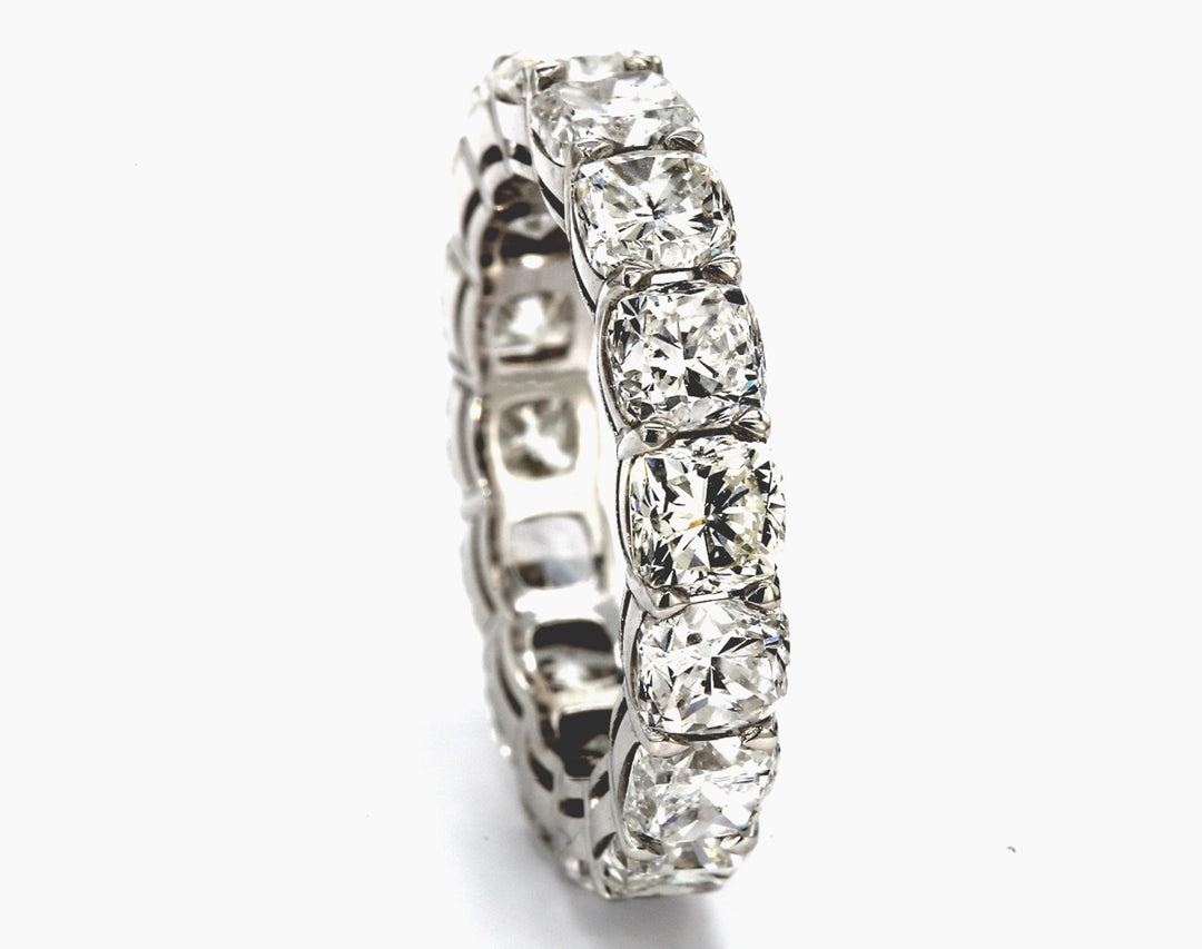 Eternity band in platinum with basket claw prong set (16) square cushion cut diamonds.  D7.98ct.t.w.  Size 6.75