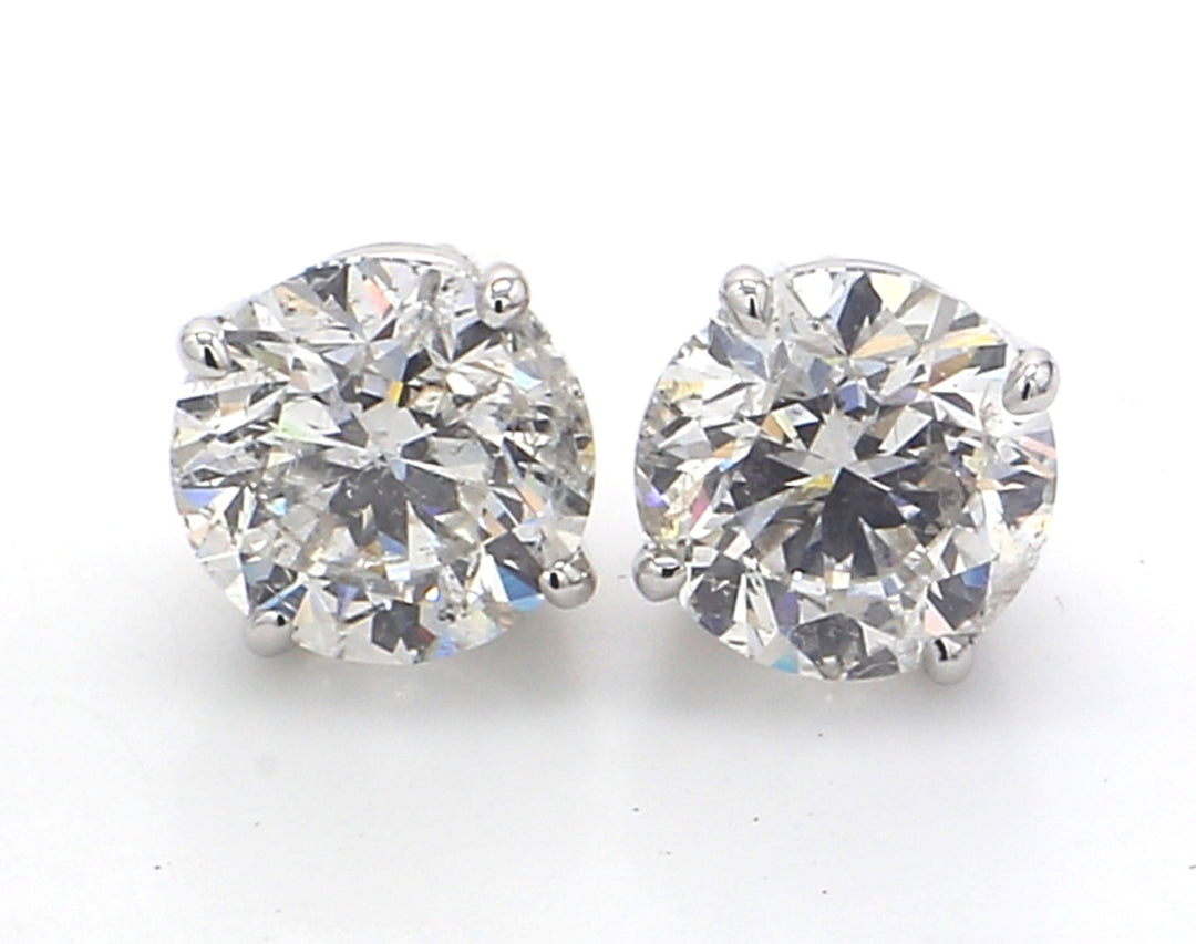 Pushback stud earrings with 4-prong basket set round diamonds.  D3.02ct.t.w.