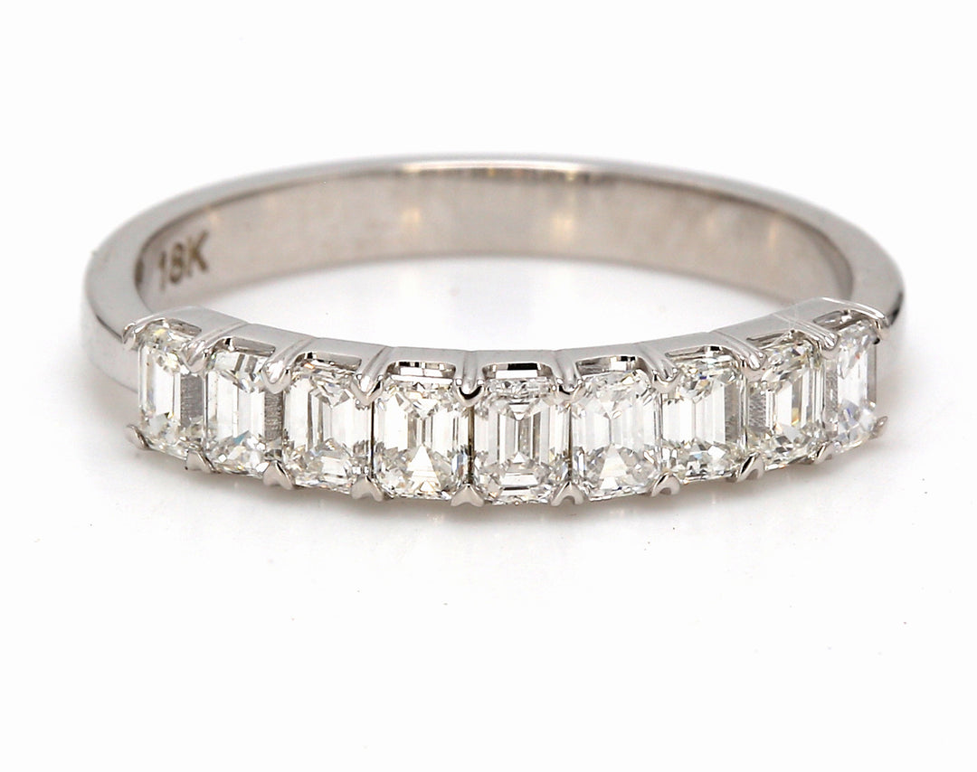 9-stone band in 18K WG with prong set emerald cut diamonds.  D0.86ct.t.w.  Size 6