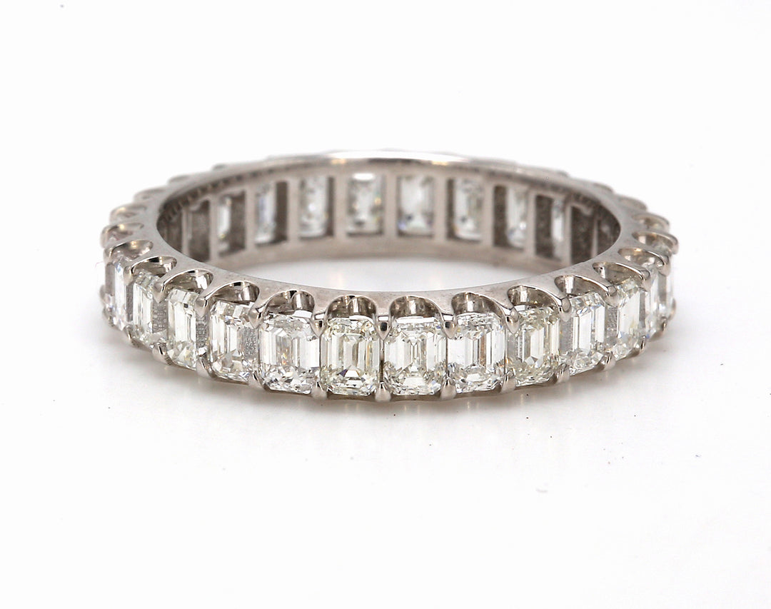 Eternity band in 18K WG with U-prong set (28) emerald cut diamonds.  D2.45ct.t.w.  Size 6