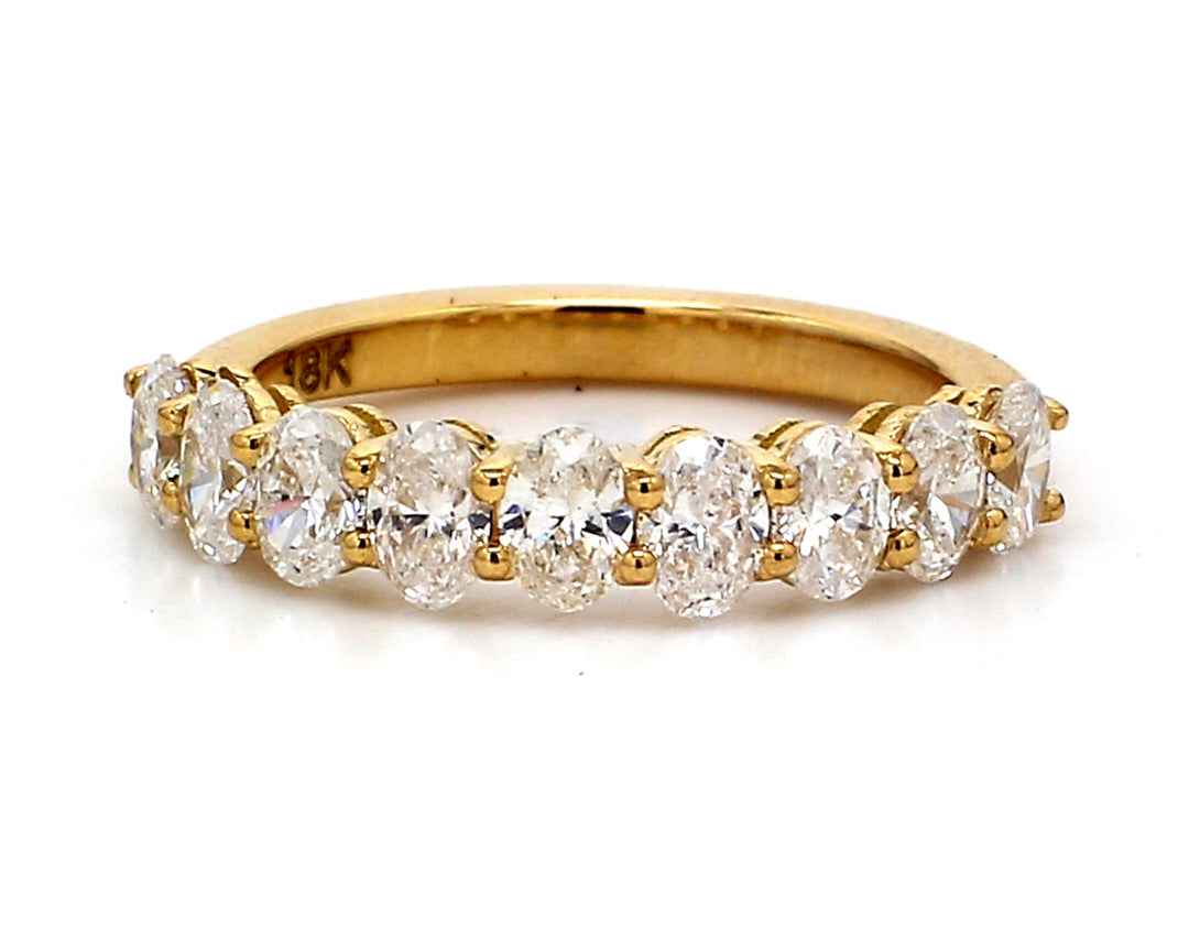 9-stone band in 18K YG with basket prong set oval cut diamonds.  D1.23ct.t.w.  Size 5.25