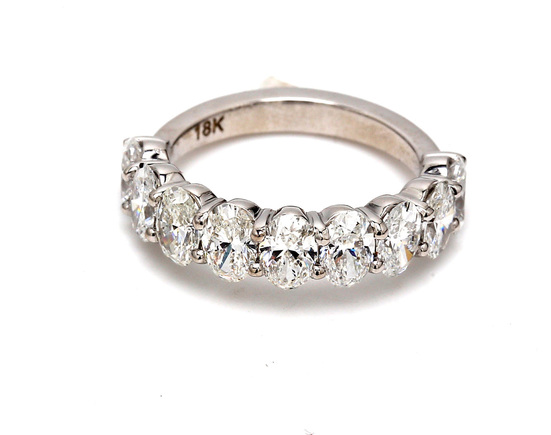 9-stone band in 18K WG with basket prong set oval cut diamonds.  D2.50ct.t.w.  Size 5.5