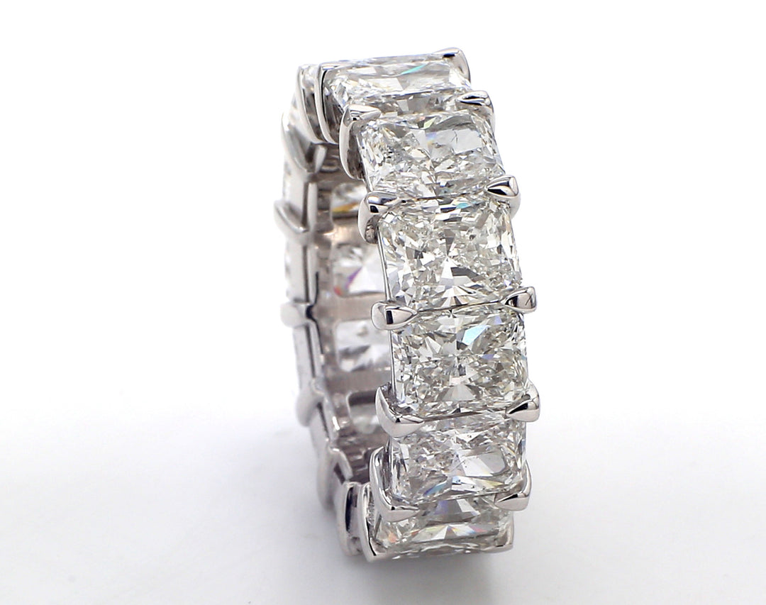 Eternity band in platinum with shared basket claw prong set (14) radiant cut diamonds.  D14.64ct.t.w.  Size 6.25