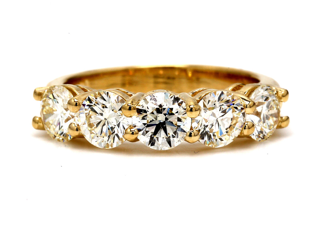 5-stone band in yellow gold with shared prong set round diamonds.  D2.78ct.t.w.  Size 7