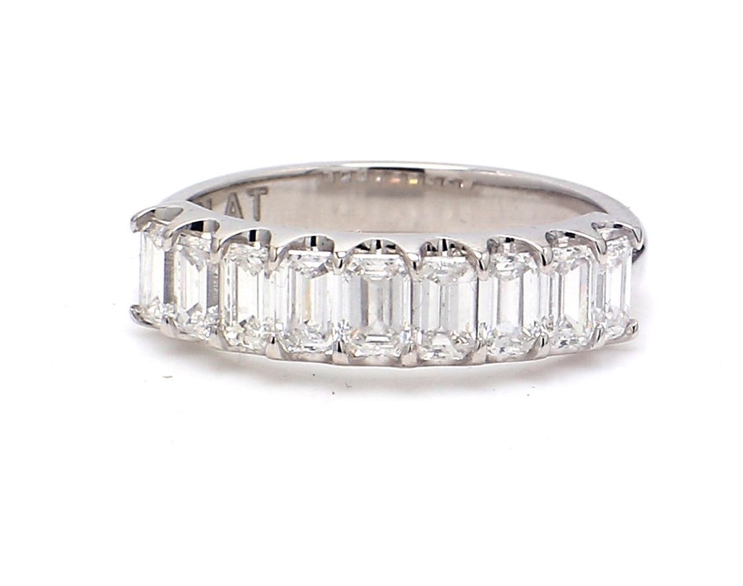 9-stone band in platinum with U-prong set emerald cut diamonds.  D1.12ct.t.w.  Size 5.25