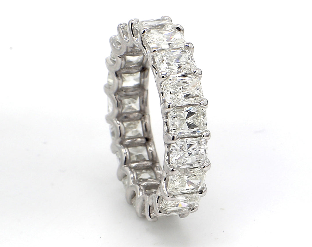 Eternity band in platinum with U-prong set (19) radiant cut diamonds.  D5.12ct.t.w.  Size 5