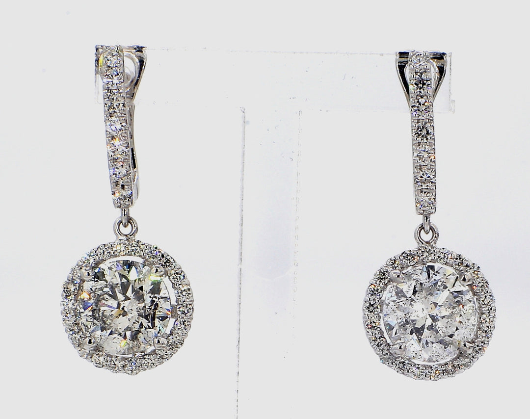 Halo dangling earring with pre-set rounds around USA certified D-E/I1 round diamonds.  D4.08ct.t.w.