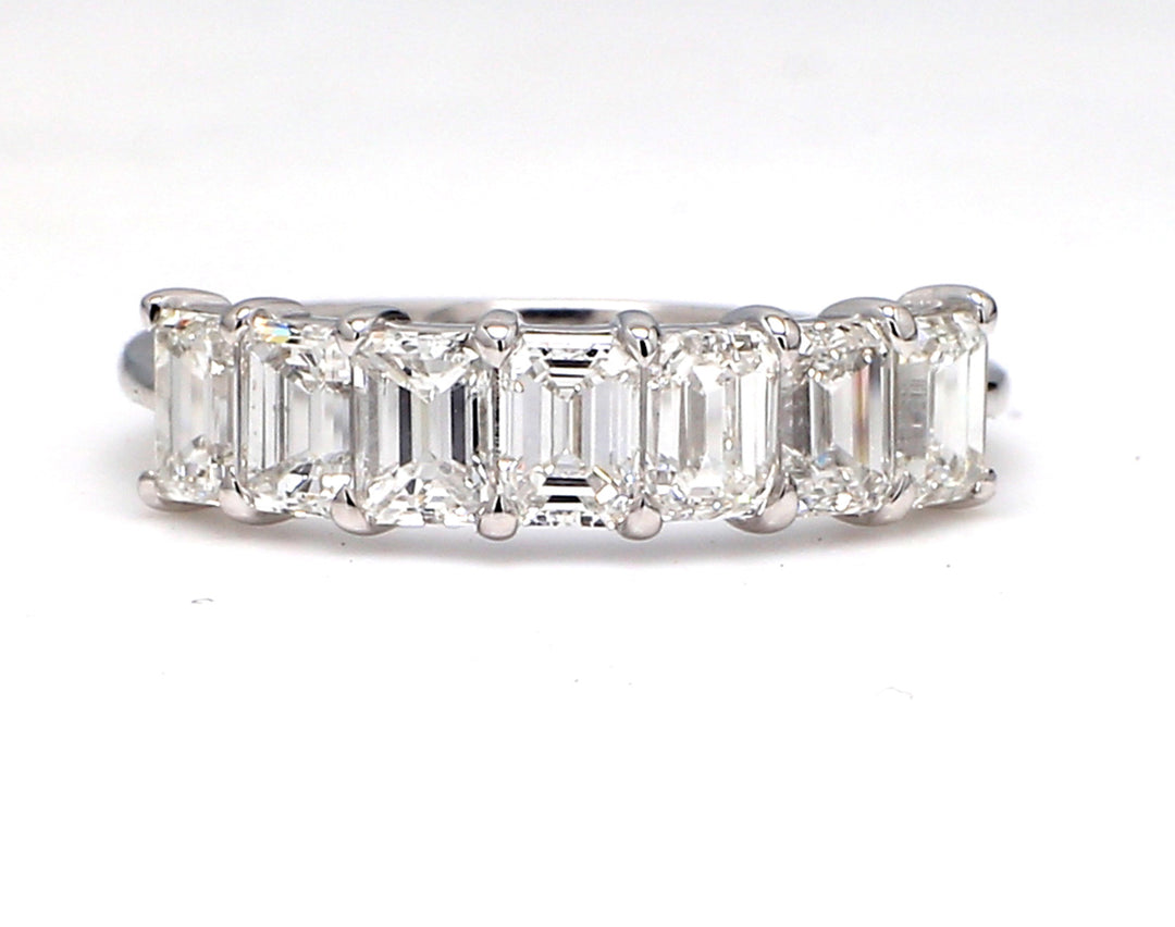 7-stone band in platinum with prong set emerald cut diamonds.  D1.82ct.t.w.  Size 6.75