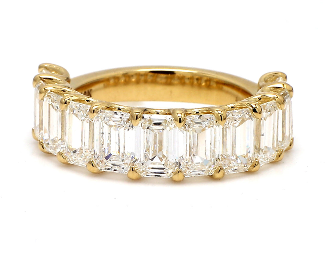 11-stone band in 18K YG with U-prong set GIA certified E-G/VVS2-VS2 emerald cut diamonds.  D7.83ct.t.w.  Size 9