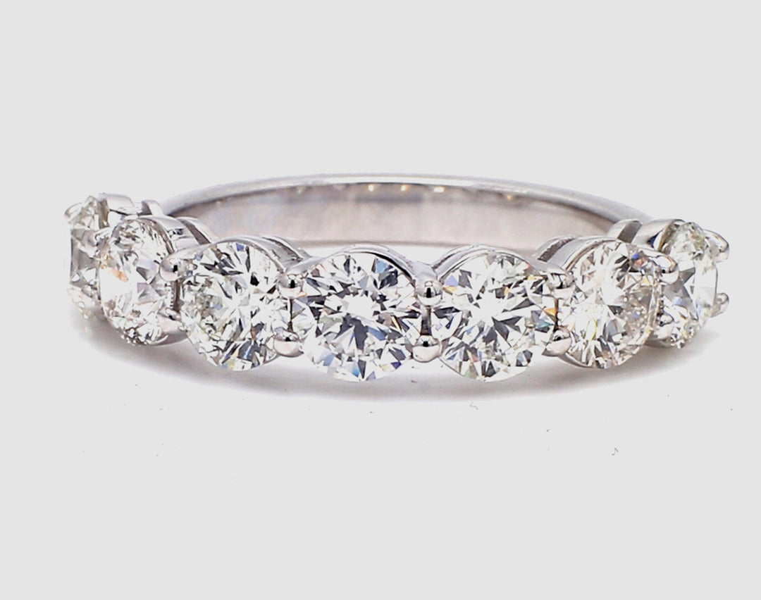7-stone band in platinum with basket prong set round diamonds.  D2.11ct.t.w.  Size 5.5