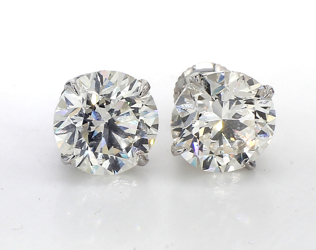 Screw back stud earrings with 4-prong set GIA certified L/VS2-SI2 round diamonds.  D8.02ct.t.w.