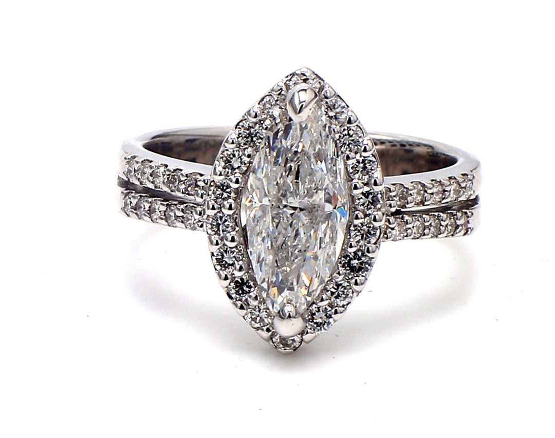 Halo ring in 18K WG with pre-set rounds around 2-prong set USA certified D/SI3 marquise diamond center.  D2.21ct.t.w.  (Center - 1.76ct.)