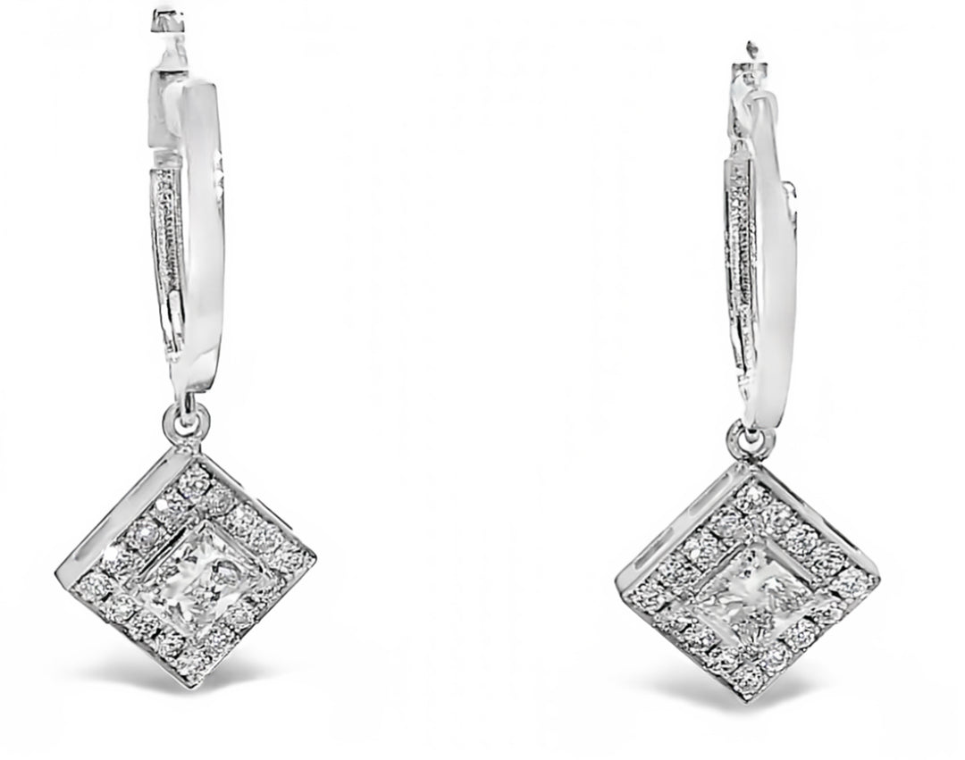 Halo dangling earrings with pave set rounds and prong set princess cut diamond center stones.  D1.19ct.t.w.