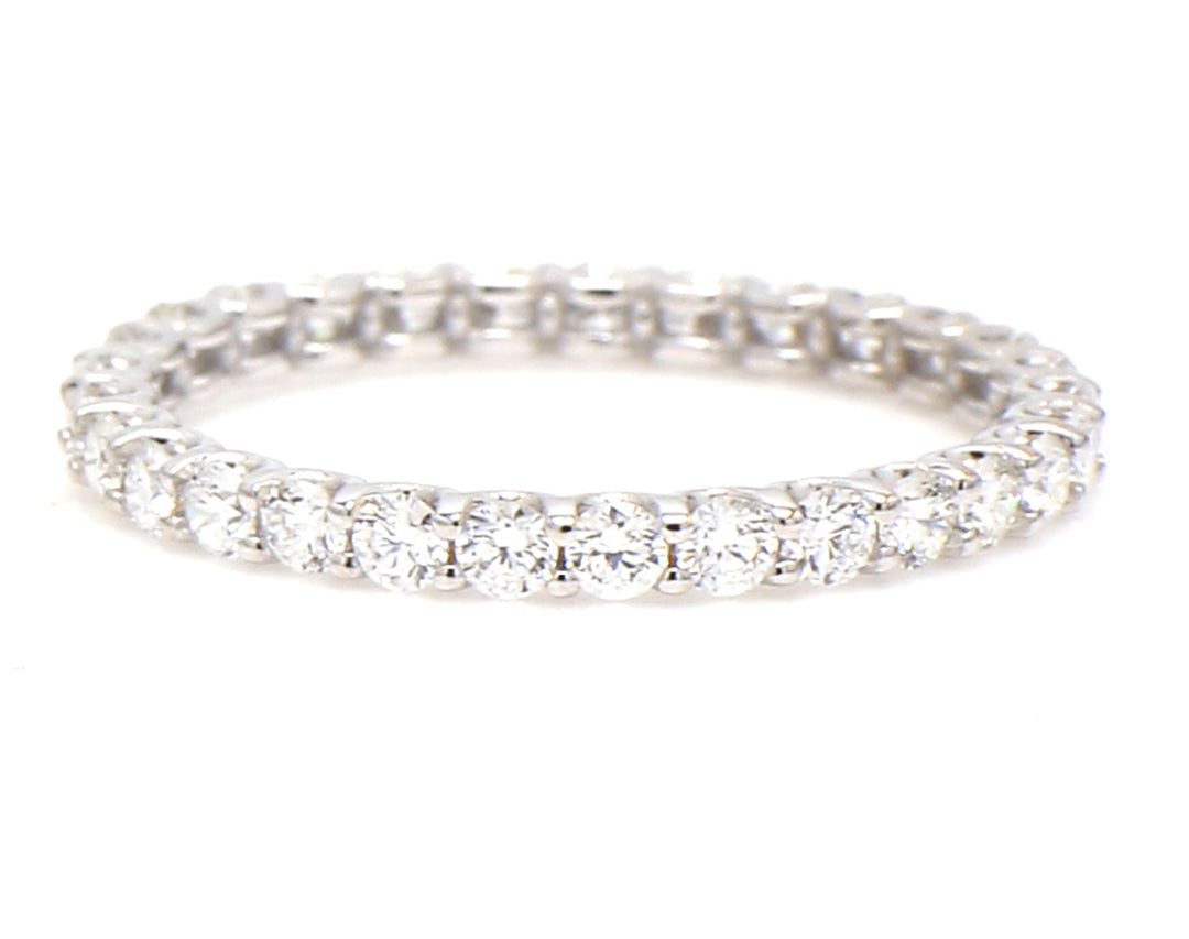 Eternity band with U-prong set round diamonds.  D0.85ct.t.w.  Size 6