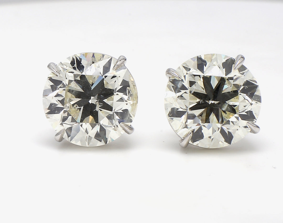 Screw back stud earrings in 18K WG with claw prong set round diamonds.  D20.03ct.t.w.