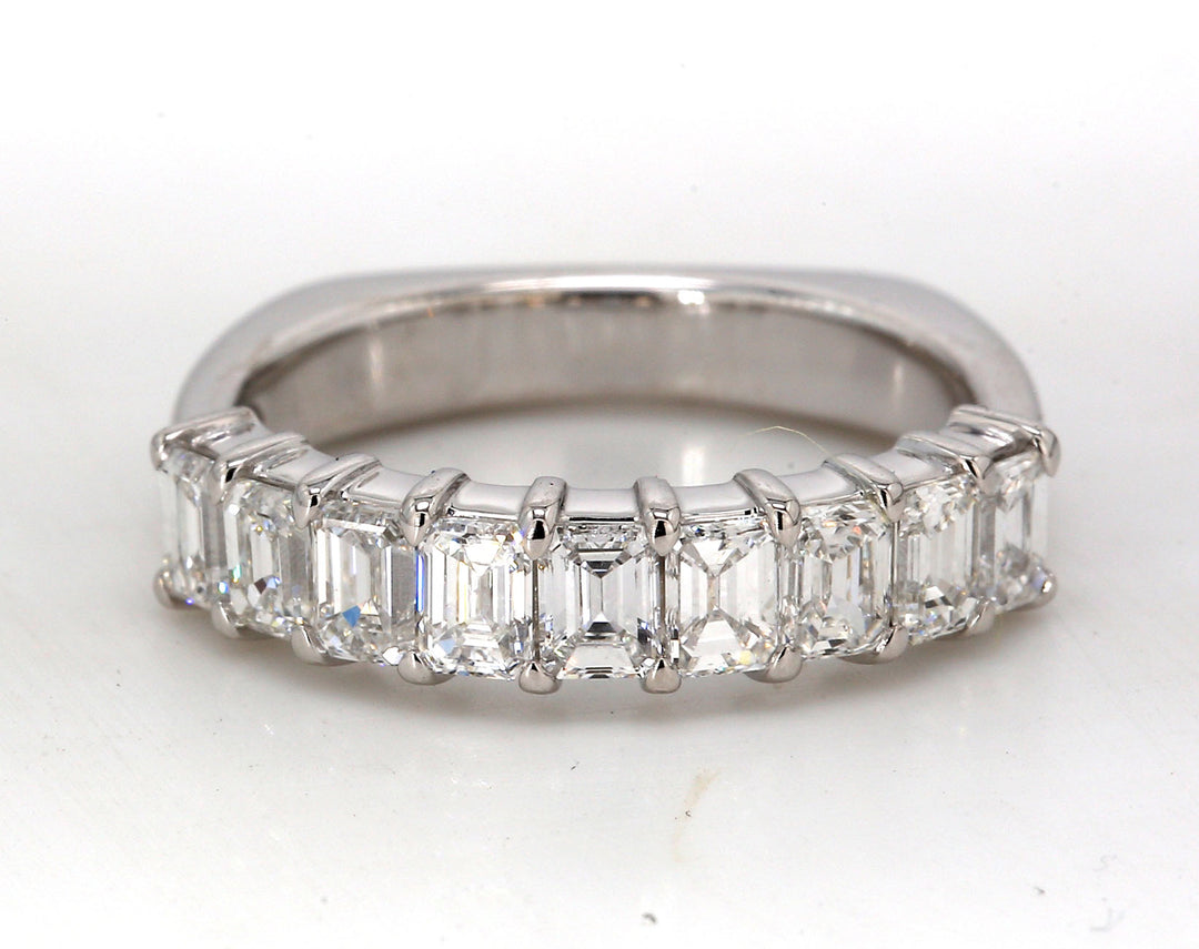 9-stone band in platinum, euro shank style with prong set emerald cut diamonds.  D1.41ct.t.w.  Size 5.75