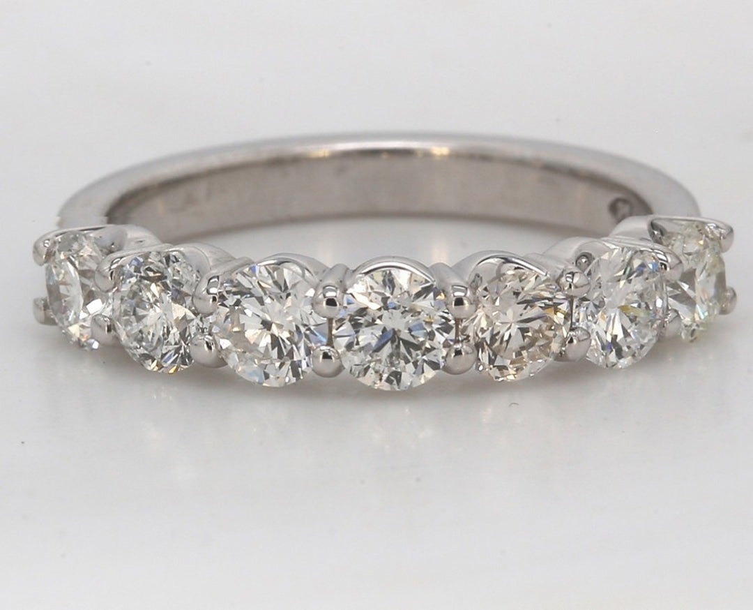 7-stone band in platinum with shared prong set round diamonds.  D1.31ct.t.w.  Size 6