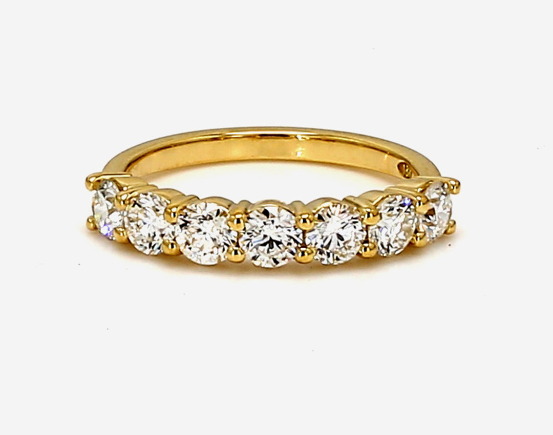 7-stone band in 18K YG with shared prong set round diamonds.  D0.99ct.t.w.  Size 5