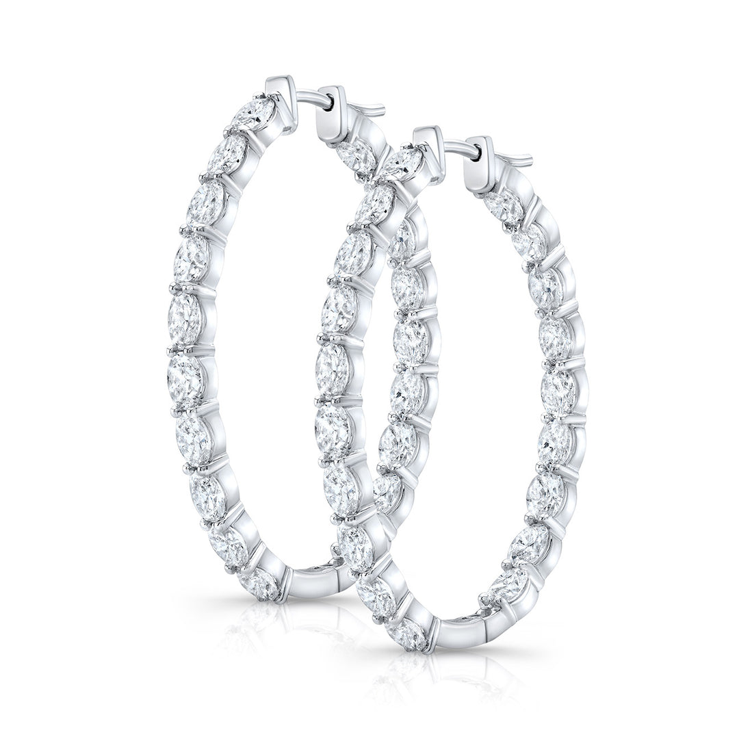 1.5"" Oval shape inside out hoop earrings in 18K WG with prong set (38) oval cut diamonds.  D8.96ct.t.w.