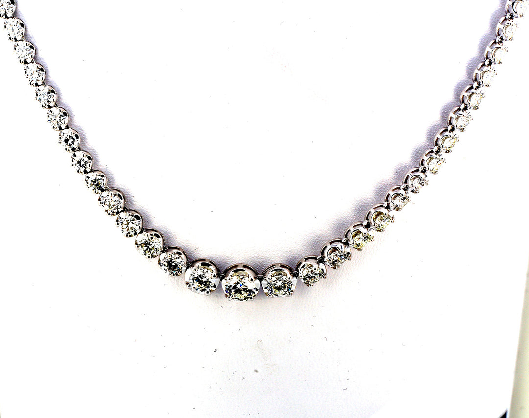 17"" Graduating tennis necklace with basket crown head, prong set (107) round diamonds.  D10.20ct.t.w.  (Center - 0.63ct.)