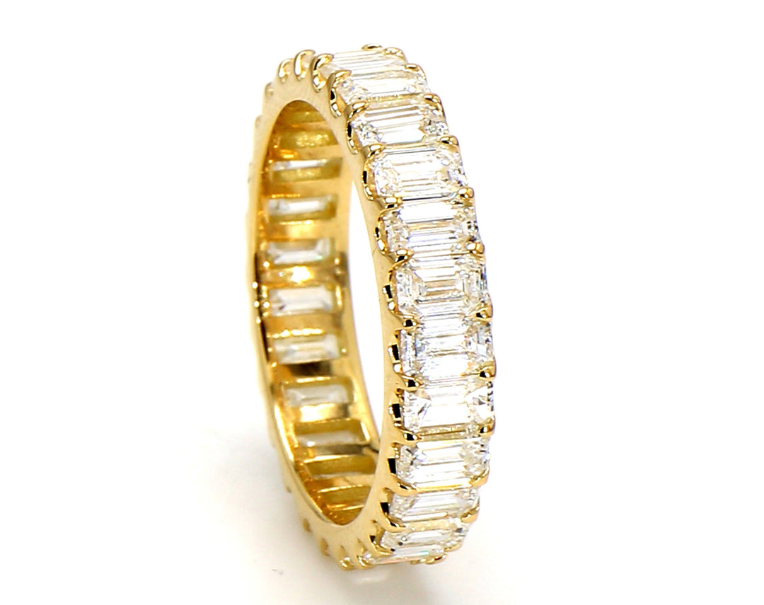 Eternity band in 18K YG with U-prong set (27) emerald cut diamonds.  D2.66ct.t.w.  Size 5