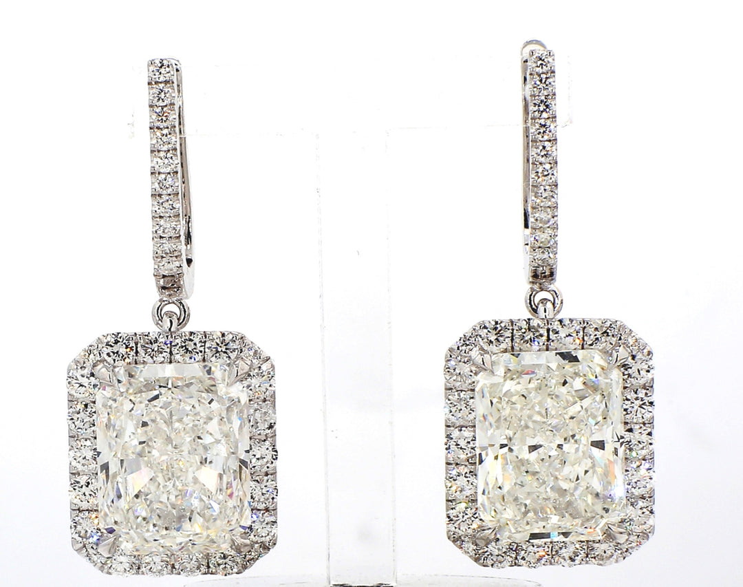 Halo dangling earring in 18K WG with pre-set rounds around a GIA certified H-I /SI1 radiant diamond center.  D17.03ct.t.w.  (Center - 15.04ct.)