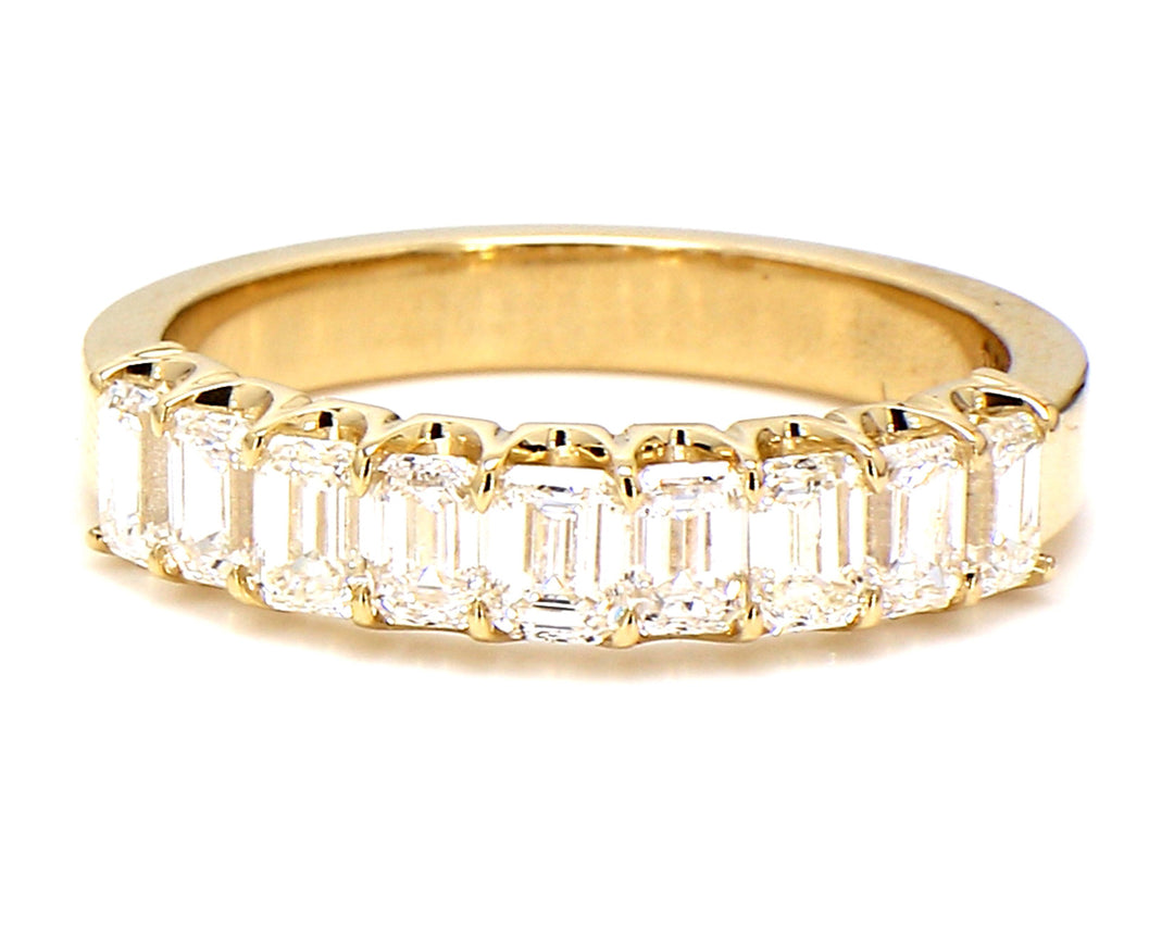 9-stone band in yellow gold with U-prong set emerald cut diamonds.  D2.16ct.t.w.