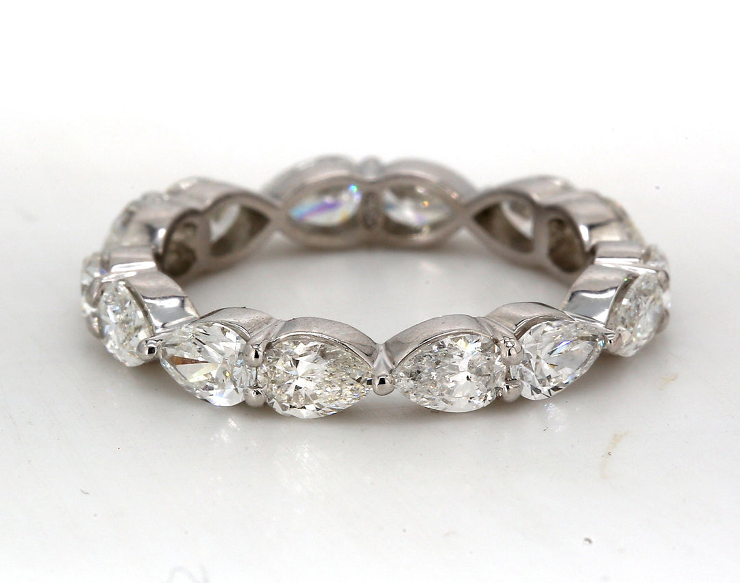 Eternity band east to west style in platinum with prong set (14) pear shape diamonds.  D2.61ct.t.w.  Size 7