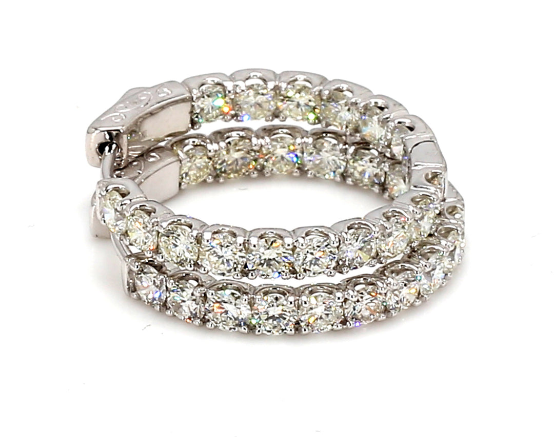 0.75"" Inside out hoop earrings with prong set round diamonds.  D3.14ct.t.w.