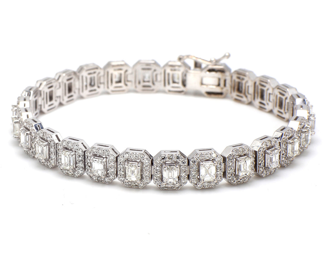 7"" Halo tennis bracelet with rounds around prong set (26) emerald cut diamond centers.  D8.92ct.t.w.