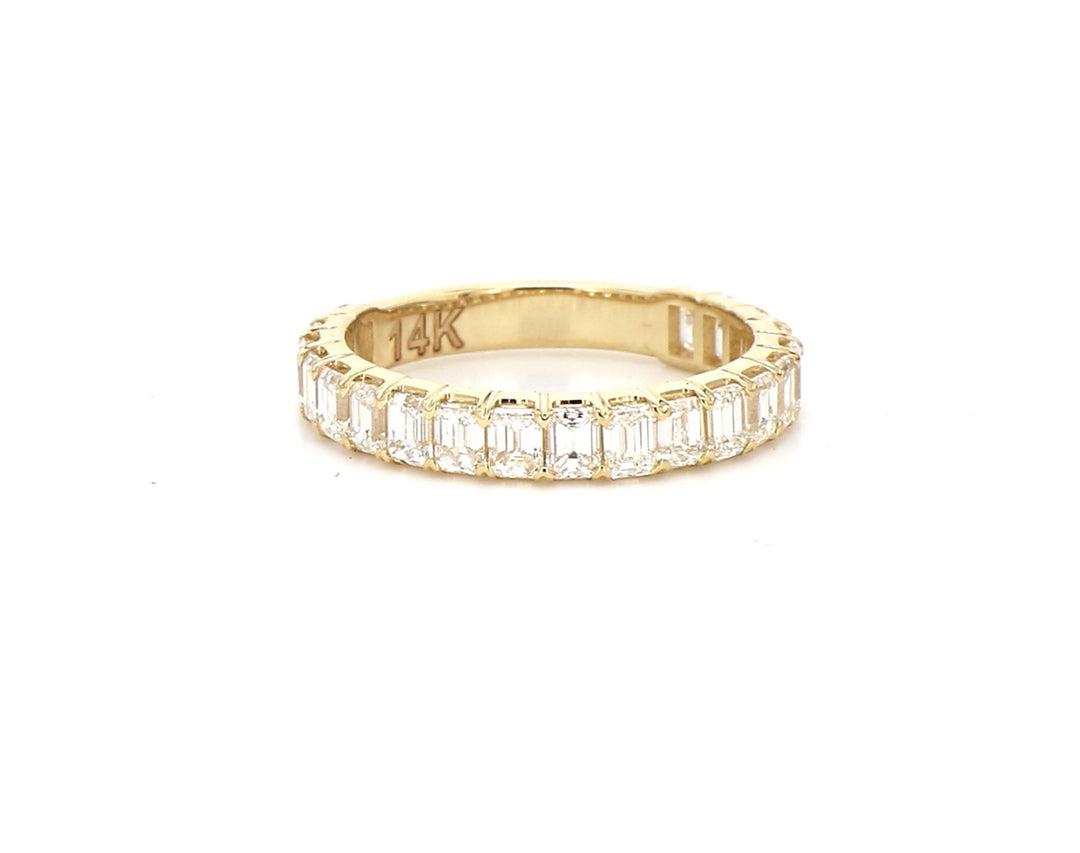 3/4 way band in yellow gold with shared prong set (20) emerald cut diamonds.  D1.69ct.t.w.  Size 5