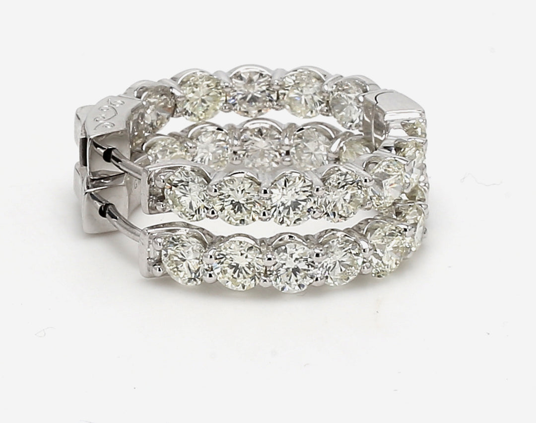 0.75"" Inside out hoop earrings with prong set (24) round diamonds.  D5 77ct.t.w.