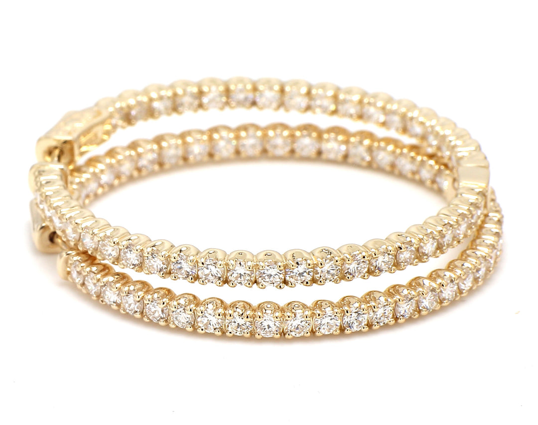 1.5"" Inside out hoop earrings in yellow gold with prong set round diamonds.  D3.64ct.t.w.