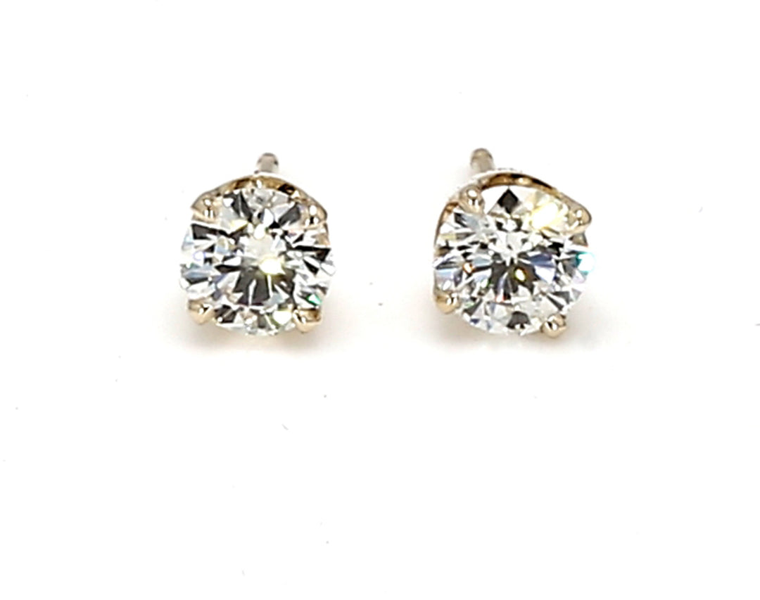 Push back stud earrings in yellow gold with prong set round diamonds.  D0.85ct.t.w.
