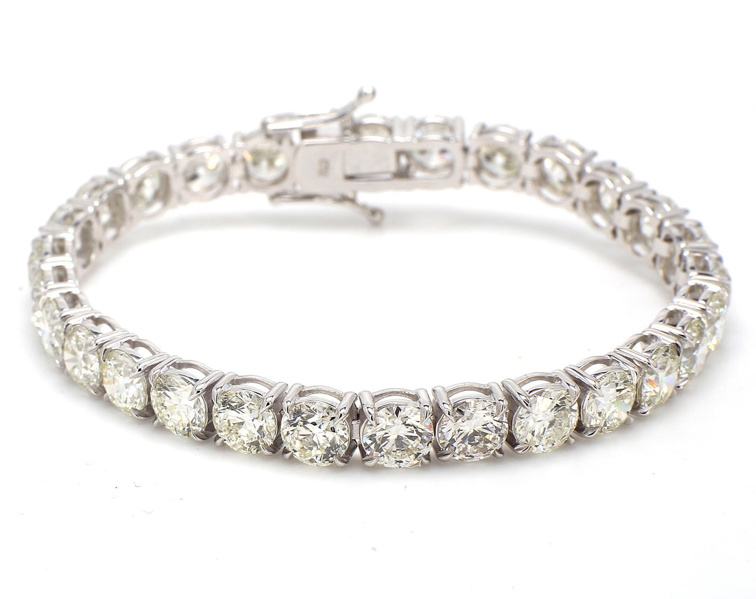 7"" Tennis bracelet in 18K wWG with basket prong set (28) round diamonds.  D25.75ct.t.w.