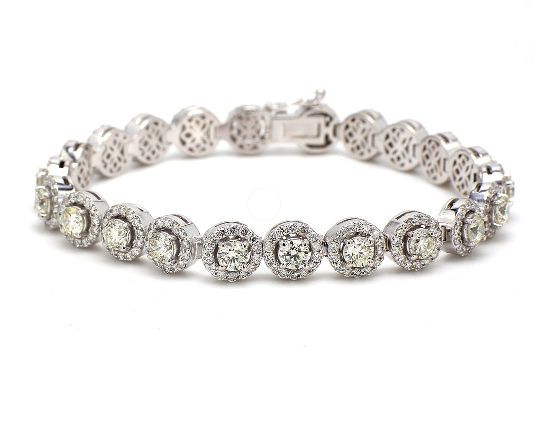 7"" Halo tennis bracelet with prong set round diamonds.  D7.23ct.t.w.