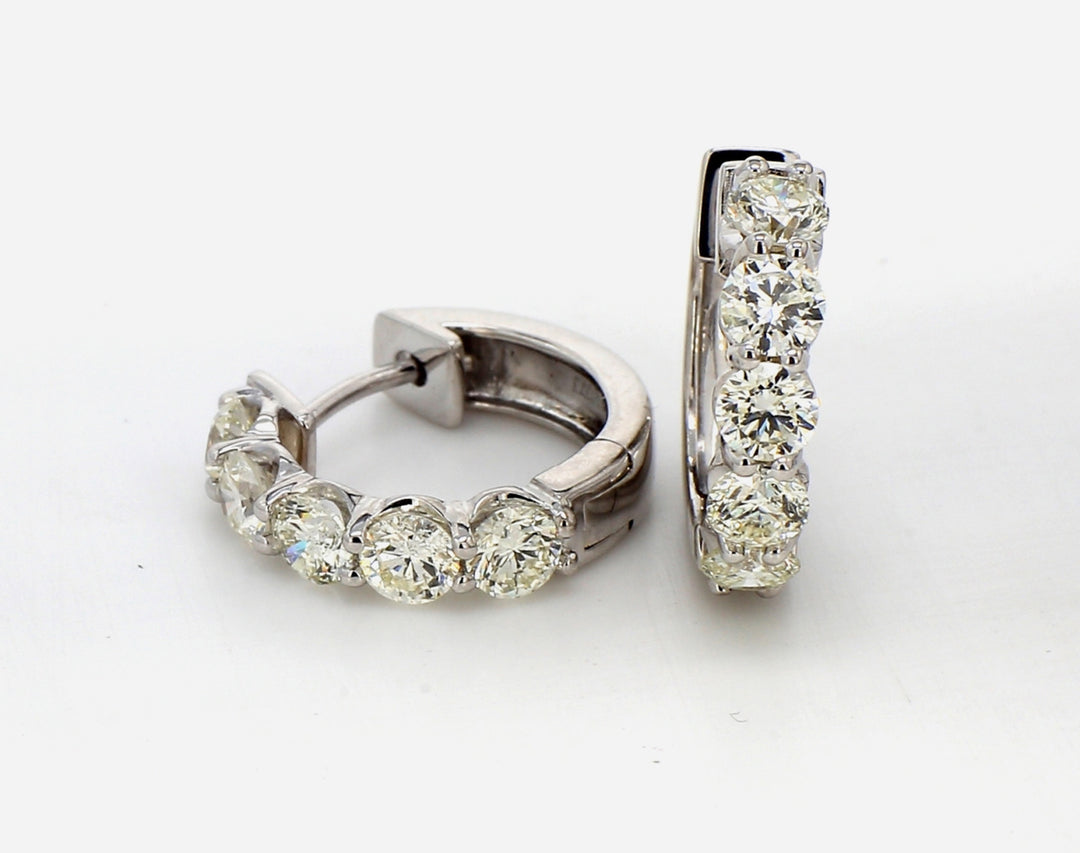 0.50"" Hoop earrings with prong set round diamonds.  D2.14ct.t.w.