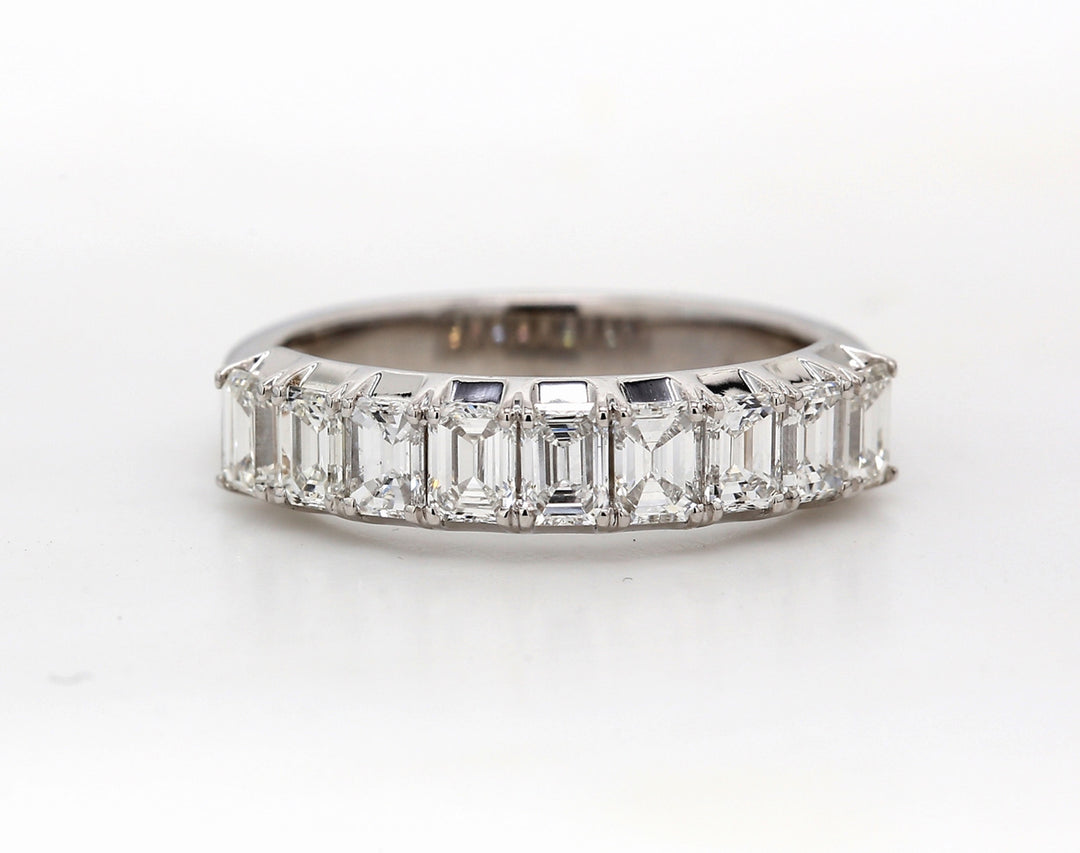 9-stone band in platinum with 4-prong set emerald cut diamonds.  D1.26ct.t.w.  Size 6