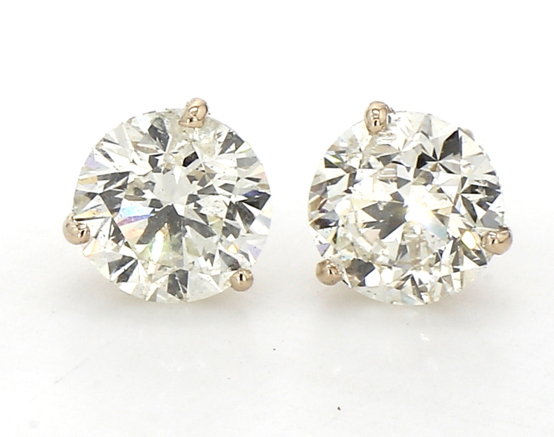 Screw back stud earrings martini style in yellow gold with 3-prong set round diamonds.  D4.01ct.t.w.