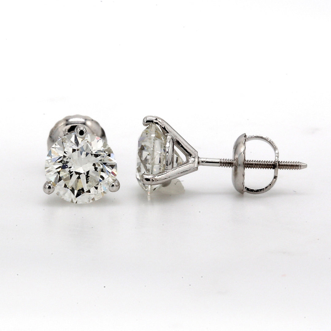 Screw back stud earrings martini style with 3-prong set round diamonds.  D4.01ct.t.w.