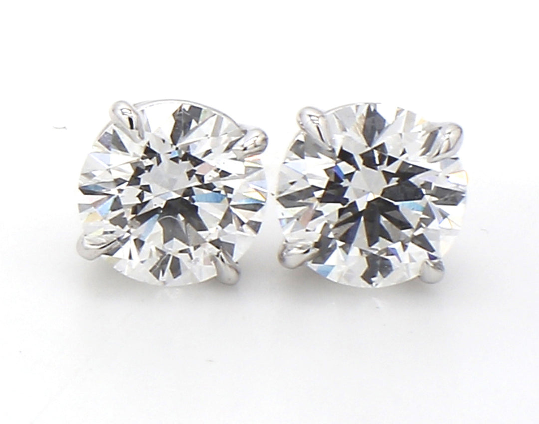 Push back stud earrings with basket prong set round diamonds.  D3.00ct.t.w.