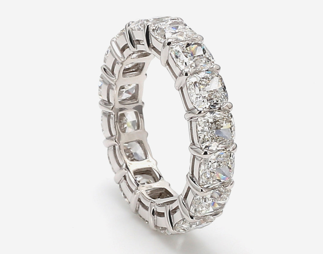 Eternity band in platinum w/ claw prong set GIA certified E-G/SI1 (16) cushion cut diamonds.  D8.52ct.t.w.  Size 7.5